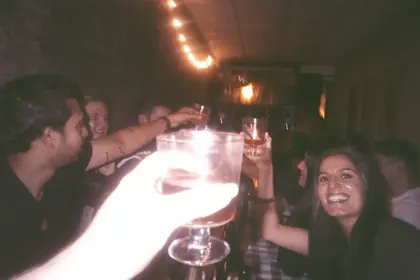 A toast at an Agora night